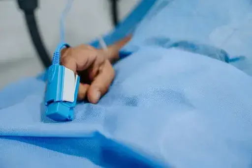 patient laying on hospital bed