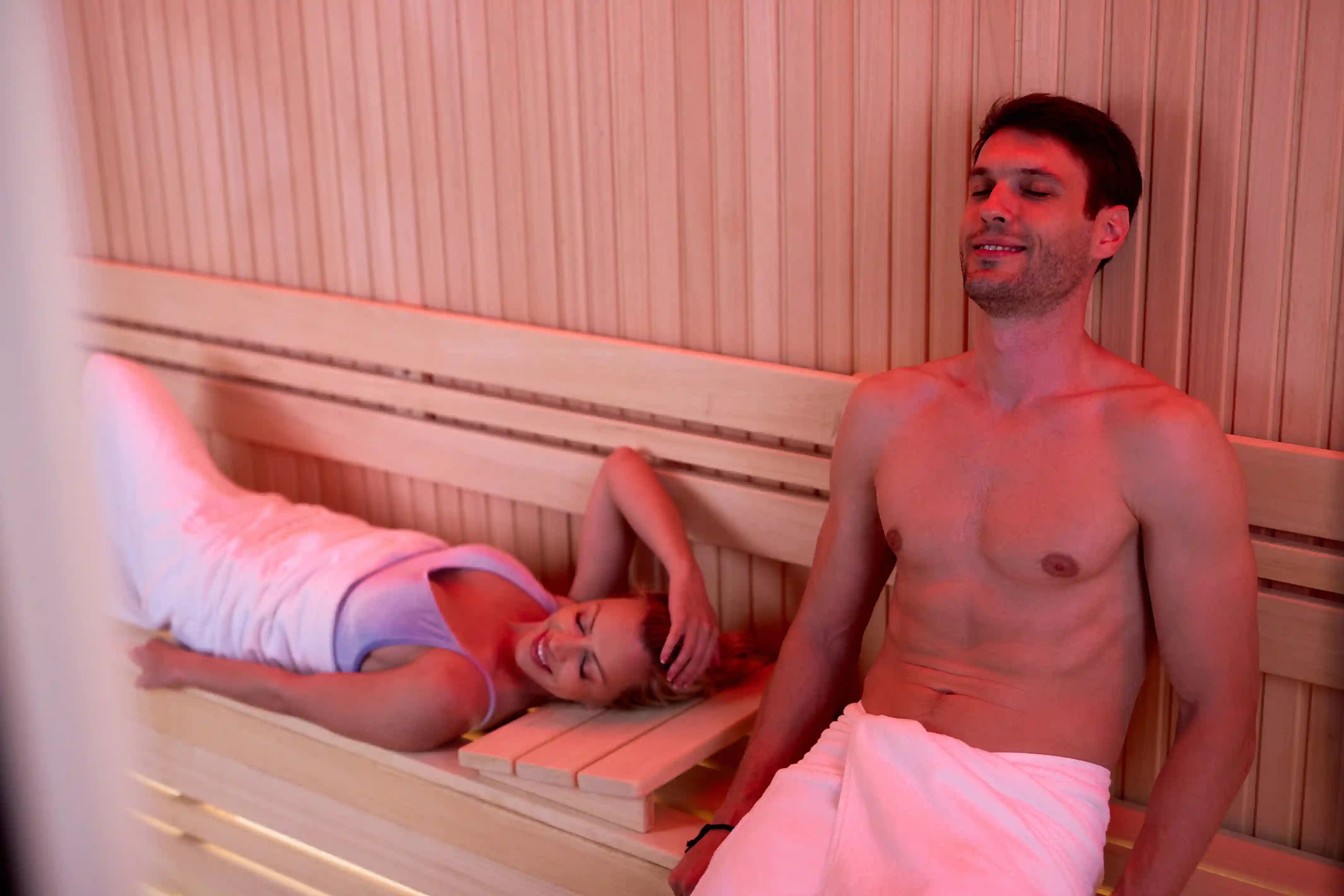 smiling couple relaxing with eyes closed sauna wellness center 11zon